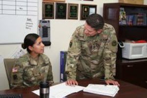 Courtesy Photo Master Sgt. Andrew Marmolejo , right, Texas Army National Guard, goes over administrative paperwork with one of the recruiters on his team. Marmolejo is the top recruiter for the Texas Army National Guard’s Recruiting and Retention Battalion, a unit consistently meets and exceeds their recruiting goals. (U.S. Army National Guard photo by Mr. Steve Johnson/ Released)